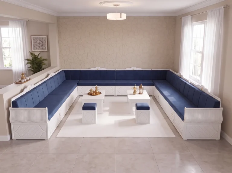 Elevated view of a white wooden majlis sofa set with navy velvet cushions, two tables and two ottomans